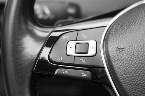 View of cruise control panel on steering wheel in modern car, closeup Stock Photos
