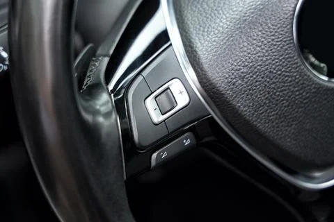 View of cruise control panel on steering wheel in modern car, closeup Stock Photos