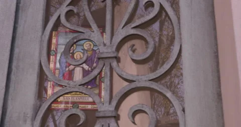 View into crypt through wrought iron door pan right Stock Footage 169258282