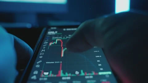 View cryptocurrency charts on a mobile phone in first person. Stock Footage 237437992