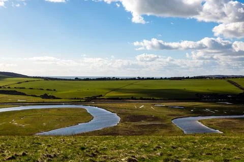 A view of the Cuckmere River and Valley in Sussex, on a sunny day in March Stock Photos