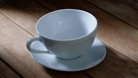 View of a cup of tea on wooden table Video stock 93115066