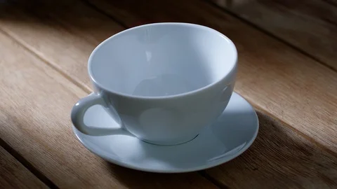 View of a cup of tea on wooden table Stock-Footage 93237458