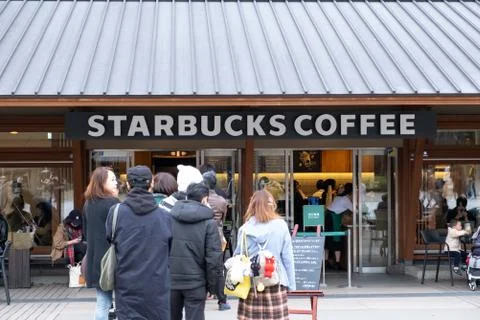 View of customers waited in the queue at Starbucks Coffee Ueno Onshi Park Stock Photos