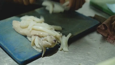 View of cutting octopuses for cooking. 4K. Stock-Footage 104492284