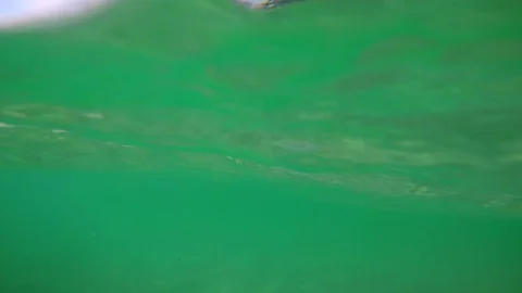 View of the Cyprus beach from the sea, the waves hit the camera, underwater Stock Footage 95177383