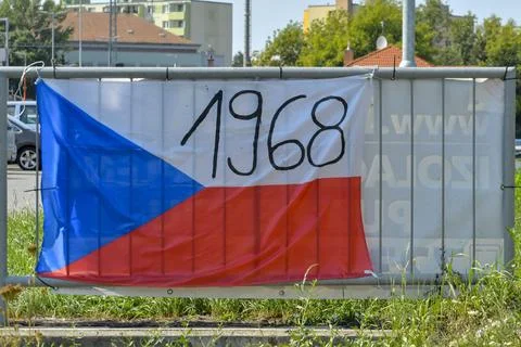 View of the Czech flag displayed on the railing. The flag shows the year 1968 Stock-Fotos