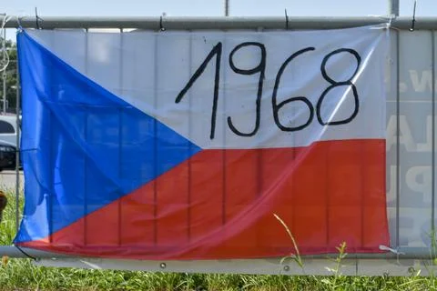 View of the Czech flag mounted on a railing. The flag shows the year 1968. On 20 Stock-Fotos