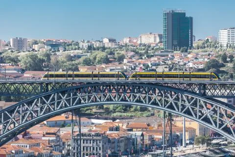 View of D. Luis bridge, with two subways to cross at the top, Douro river wit Stock Photos