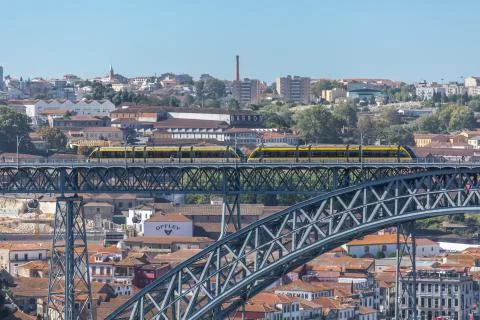 View of D. Luis bridge, with two subways to cross at the top, Douro river wit Stock Photos