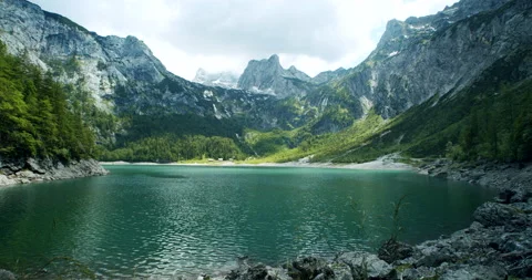 View of Dachstein from the lake Hinterer Gosausee lake, Upper Austria Stock Footage 136450316