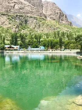 A view of Dal Lake in winter, and the beautiful mountain range in the background Stock Photos