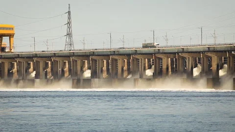 View of the dam on the river. On top is the highway. Electricity, green energy Stock Footage 154269845