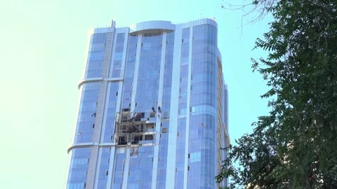 View of damaged apartment complex with broken windows, attack drone Video stock 282733315