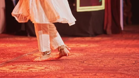 View of a dancer wearing ankle bells performing graceful Indian classical d.. Video stock 332915995
