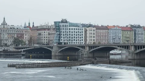 View of dancing house over the river in Prague Timelapse Video stock 124857948