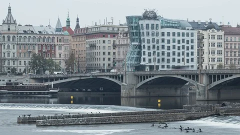 View of dancing house over the river in Prague Timelapse Video stock 124857953