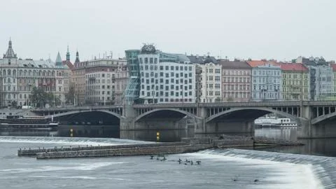 View of dancing house over the river in Prague Stock Photos