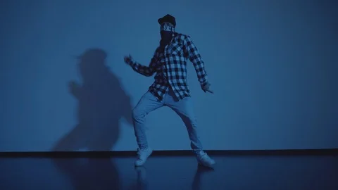 View of dancing in interior on blue background 库存影片 119042727