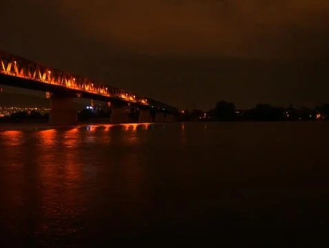 View on the Danube river and the Train bridge in Budapest Hungary after sunse Stock Photos
