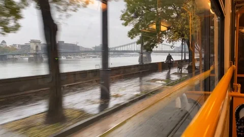 View of Danube river from tram window on a rainy day in Budapest, Hungary Stock Footage 119767429