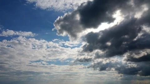 View on the dark and white clouds over sea Stock Photos