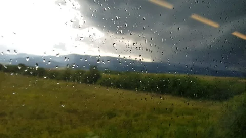 View Of Dark Clouds And Rain Drops From A Window Of A Moving Train Transylvania Video stock 113614671