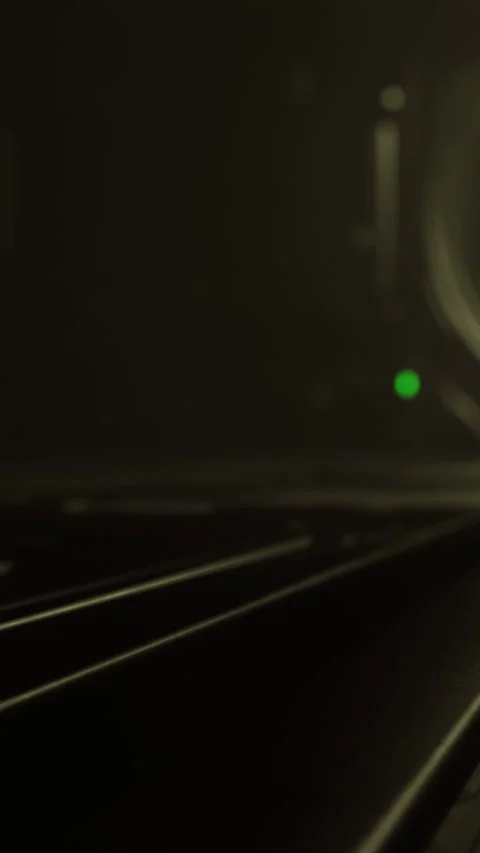 View of a dark room with a green light and lines on a surface Stock Footage 337972781