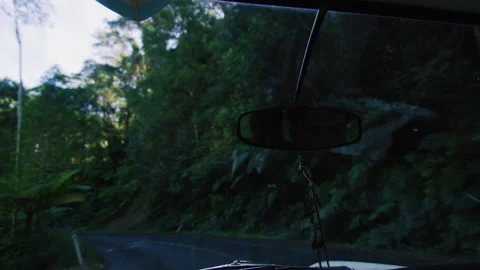 View from dashboard of vintage car, driving along country road Australian summer Stock Footage 199456819