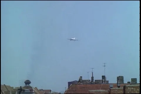View of DC-6 and C-54 come in over apartments and landing singly - 1961 Stock Footage 101166810