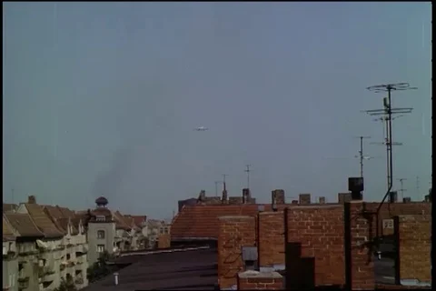 View of DC-6 and C-54 come in over apartments and landing singly - 1961 Stock Footage 101166818