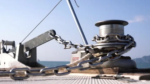 View from the deck of the boat, close-up of the anchor chain and stand for the Stock Footage 258094337