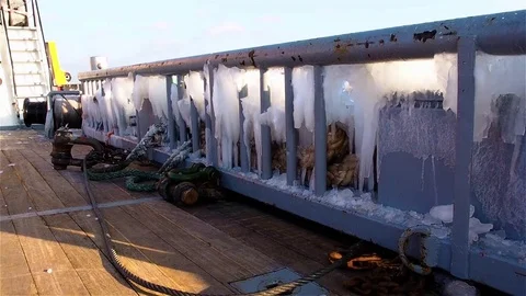 View of deck with cabel, ladder and board covered with lots of ice Stock Footage 72306994