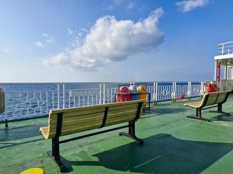 View of deck of ferry ship. Benches and trash bins Stock Photos