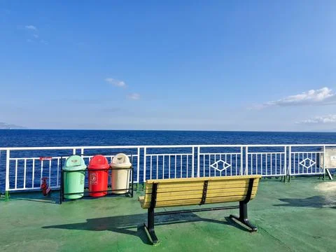 View of deck of ferry ship. Benches and trash bins Stock Photos