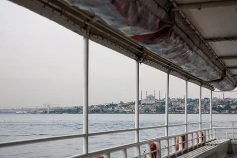 The view from the deck of the ship on the misty cloudy calm Bosphorus. Istanb Stock Photos