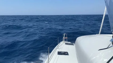 View from the deck of the yacht at the bow, closeup. Side view with green sea Stock Footage 140409528