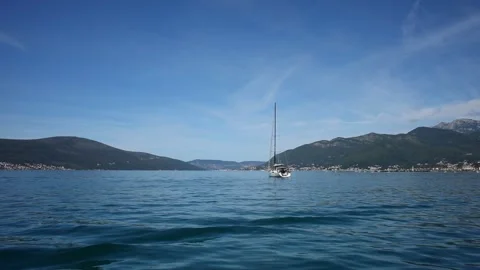 View from the deck of the yacht to the passing boat. Stock Footage 248521963