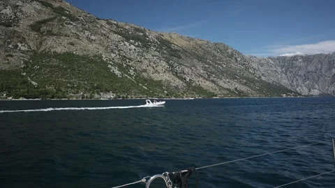 View from the deck of the yacht to the passing boat. Stock Footage 249086234