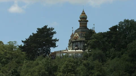 View of a decorated tower surrounded by trees in Prague Video stock 55871357