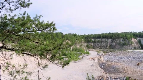 View of a deep granite quarry with granite mining equipment. Tall cliffs 스톡 동영상 134393668
