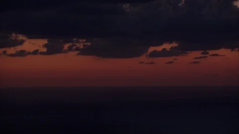 View of deep-red sunset from Stromboli volcano, facing out to the sea. Stock Footage 86754052