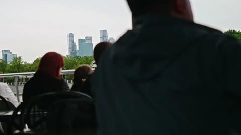 View of defocused people on foreground and focused view of Moscow City Towers Stock Footage 154734989