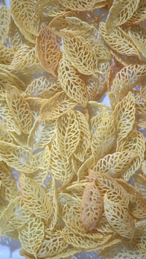 View of delicate leaf-shaped lace crisps with light golden color, close up shot Видео 330913190