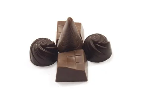 View of delicious assorted chocolates isolated on a white background Stock Photos