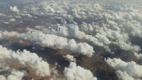 View of the desert, clouds and sky from an airplane, Egypt Stock Footage 328486486