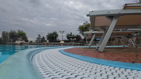 View of a deserted pool in bad weather	 Video stock 311926764