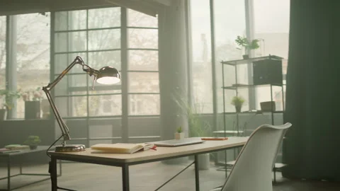 View on desk with a laptop and notebook in empty modern office. Workspace Stock Footage 279056917