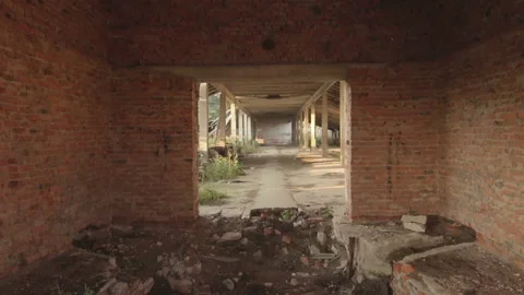 View in the destroyed abandoned cowshed building in the old village in Belarus Video stock 99482526
