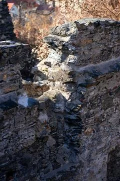 View of the destroyed brick wall of an ancient European castle. Stock Photos